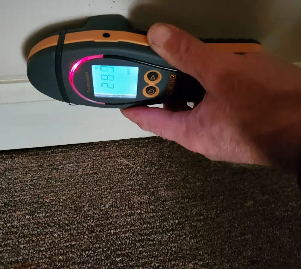 Moisture detection at baseboard during Storm Damage Restoration in Port Lavaca